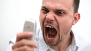 Angry man with mobile phone