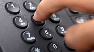 Dialling a number on a landline telephone