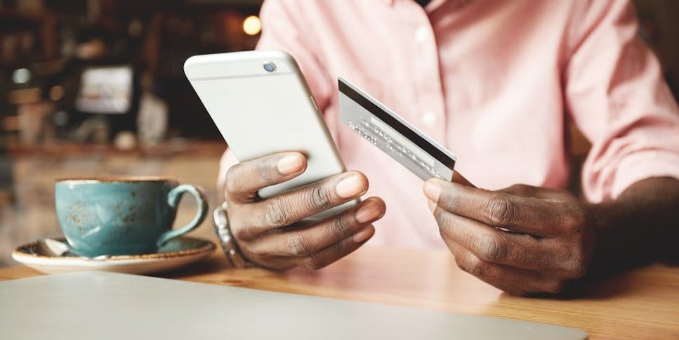 Hands holding credit card