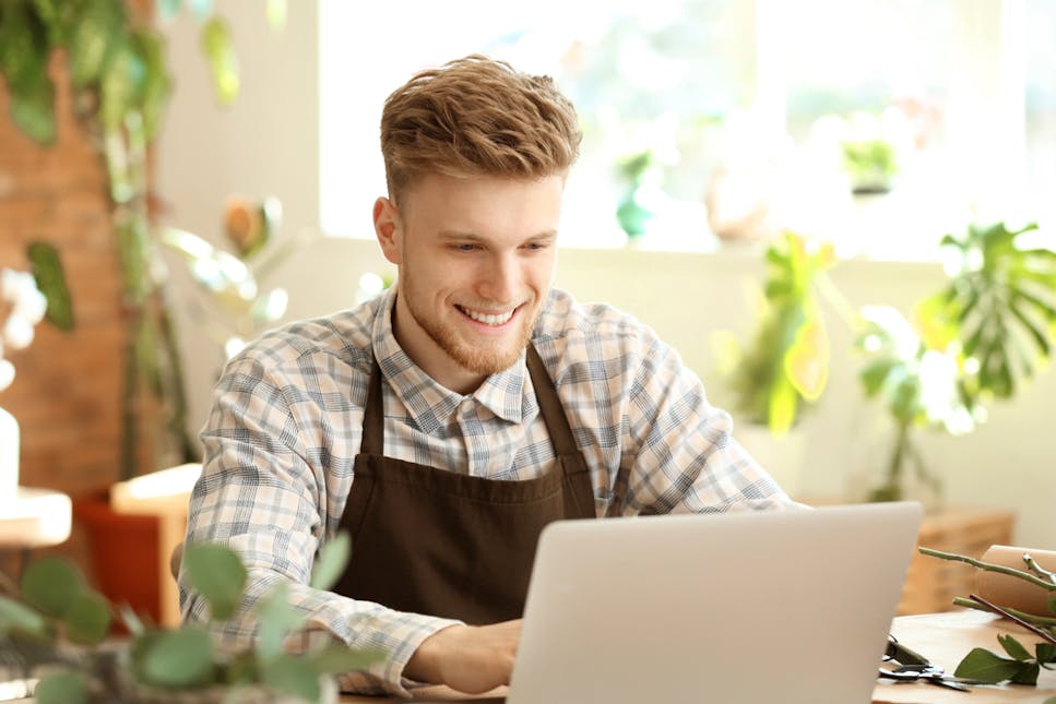 Young business owner with laptop