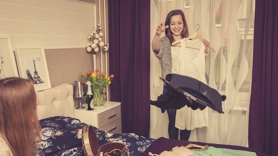 Girls trying on dresses