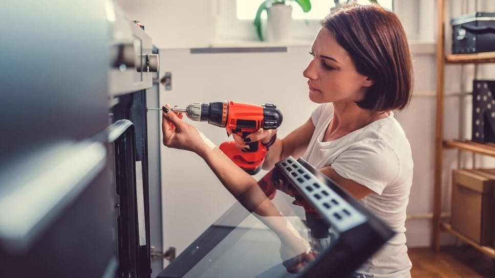 Woman doing DIY in kitchen