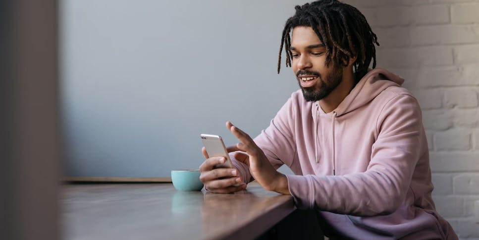 Man looking at credit score on phone
