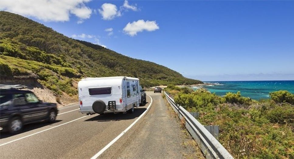 Caravan on scenic coastal road 
