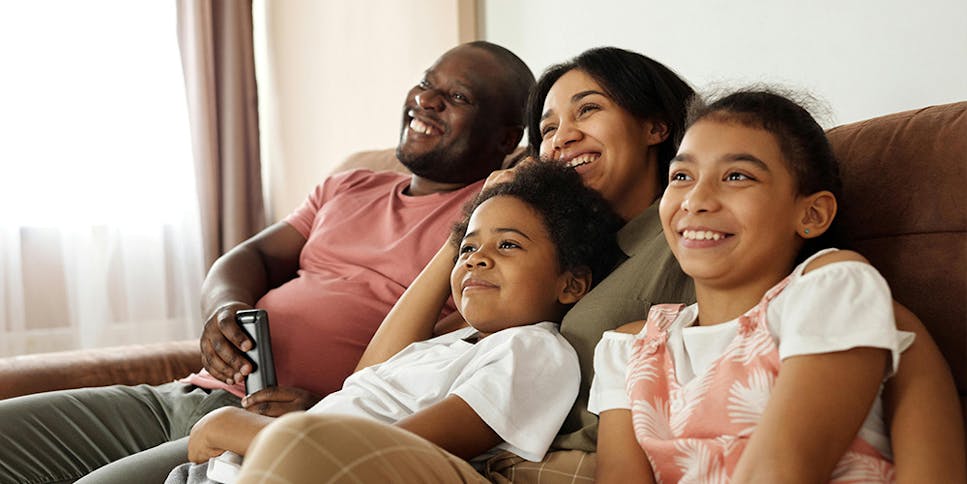 Happy family sitting together