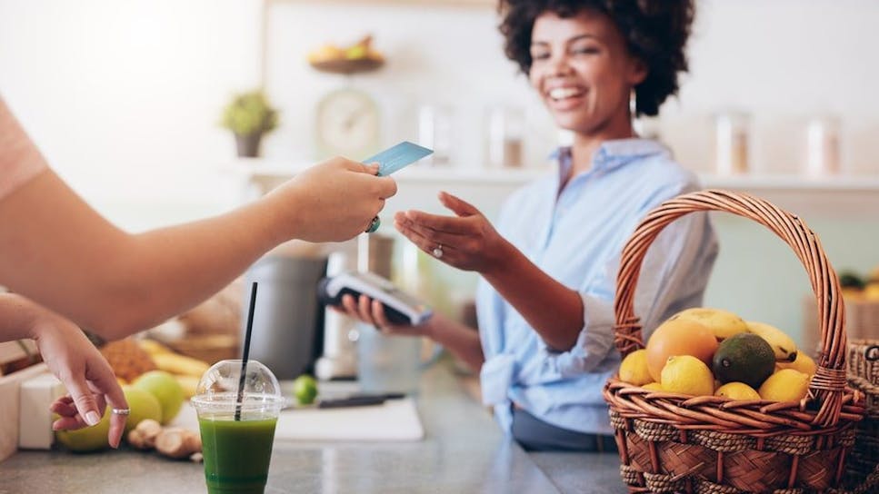 Woman using card to pay