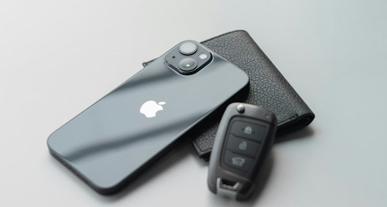 Car key, wallet and phone