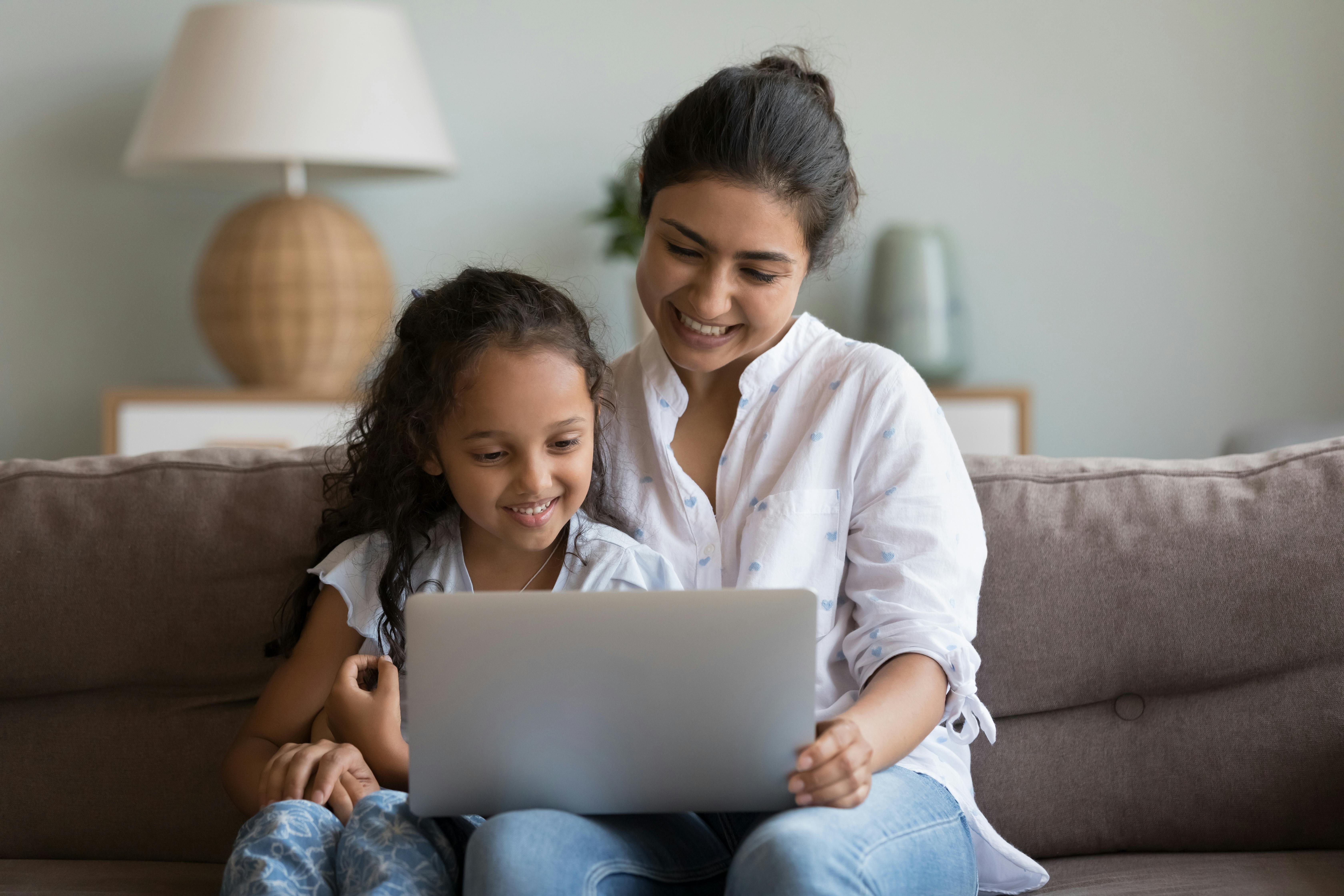 Mum with child on laptop