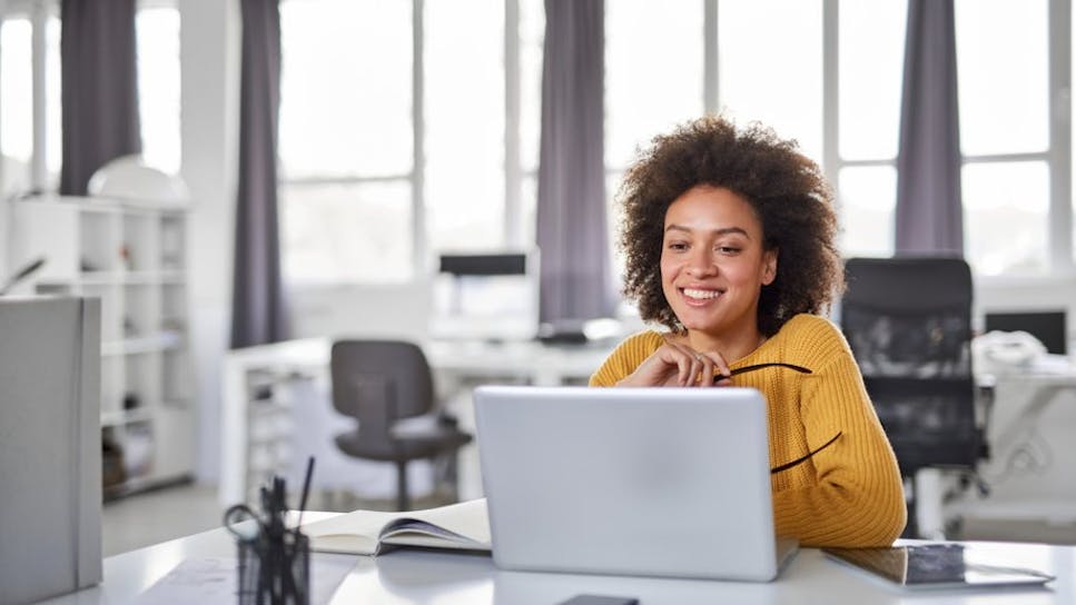 Woman using laptop in office