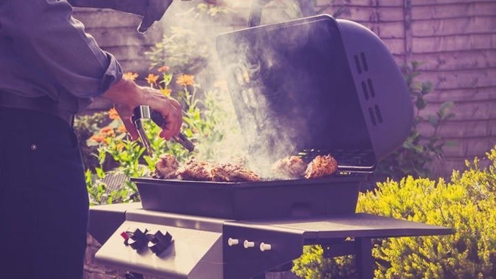 Chicken being grilled on a barbecue