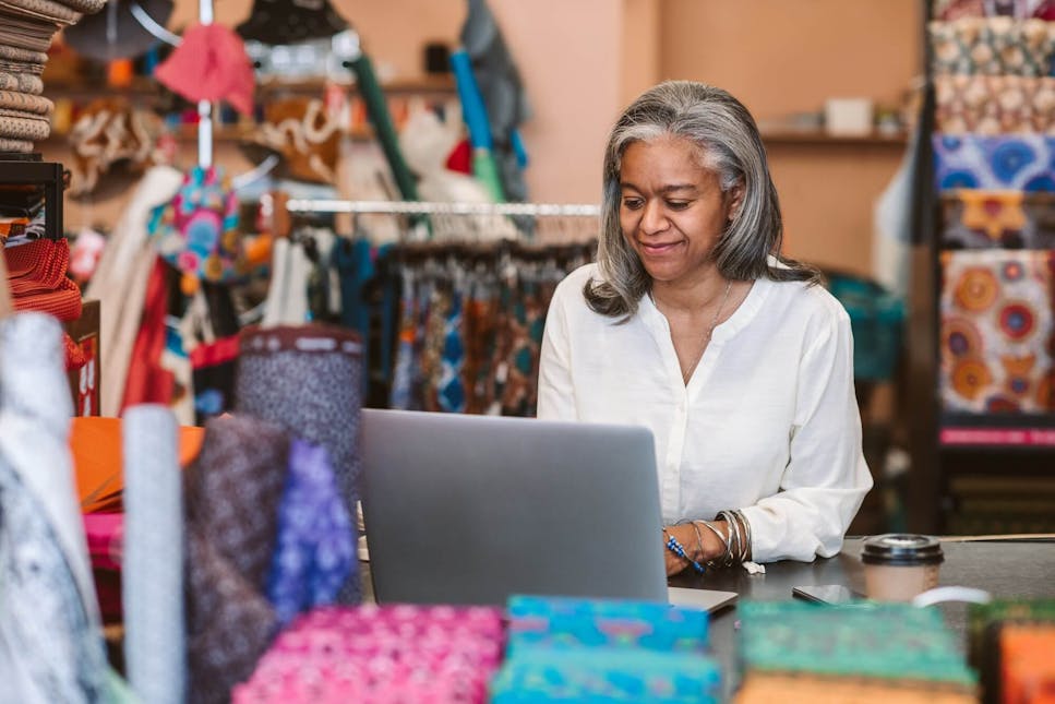 Female business owner at laptop
