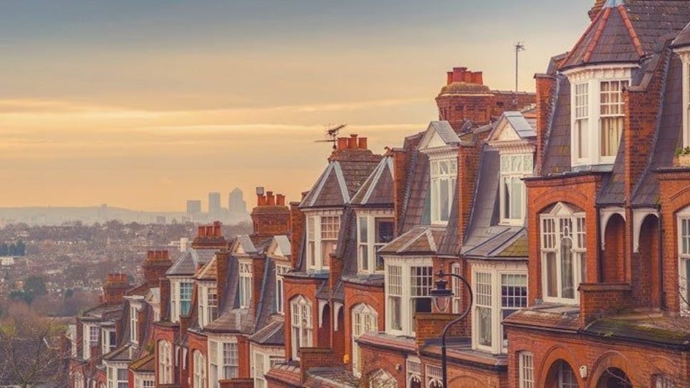 View of terraced houses with sunset background