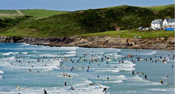 Surfers and bodyboarders in Cornwall