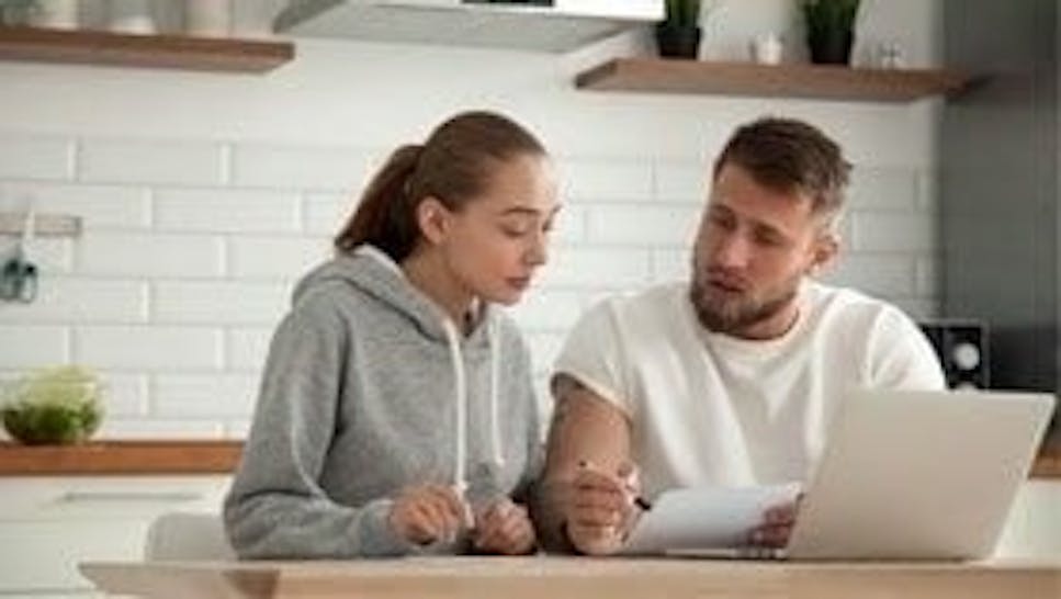 couple looking at credit statements