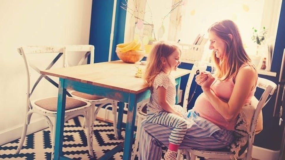 Mother and daughter at table
