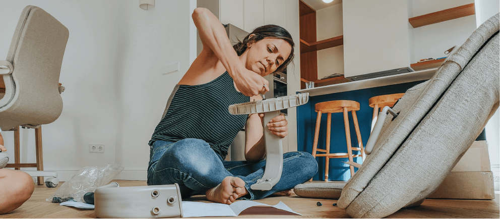 Person putting together flatpack furniture