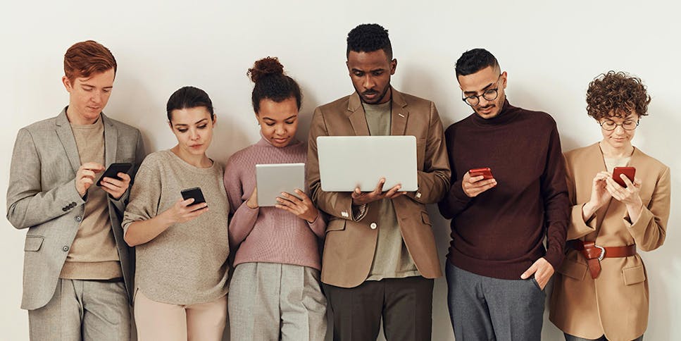 Group of people using electronics