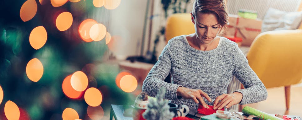 Woman wrapping Christmas presents