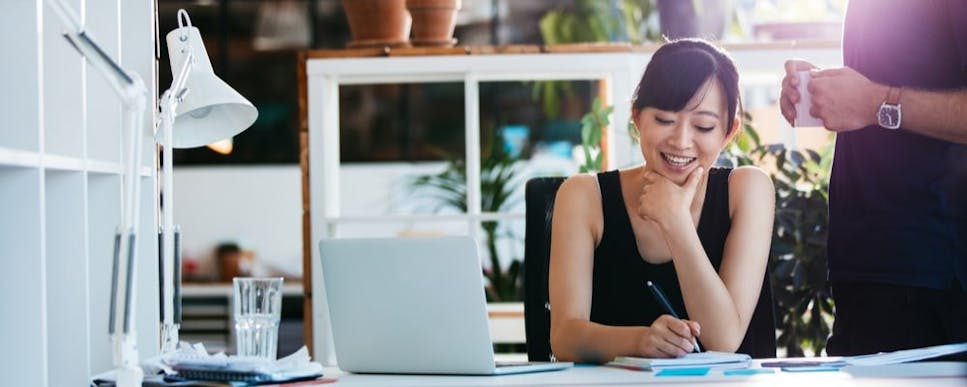 Woman smiling with laptop