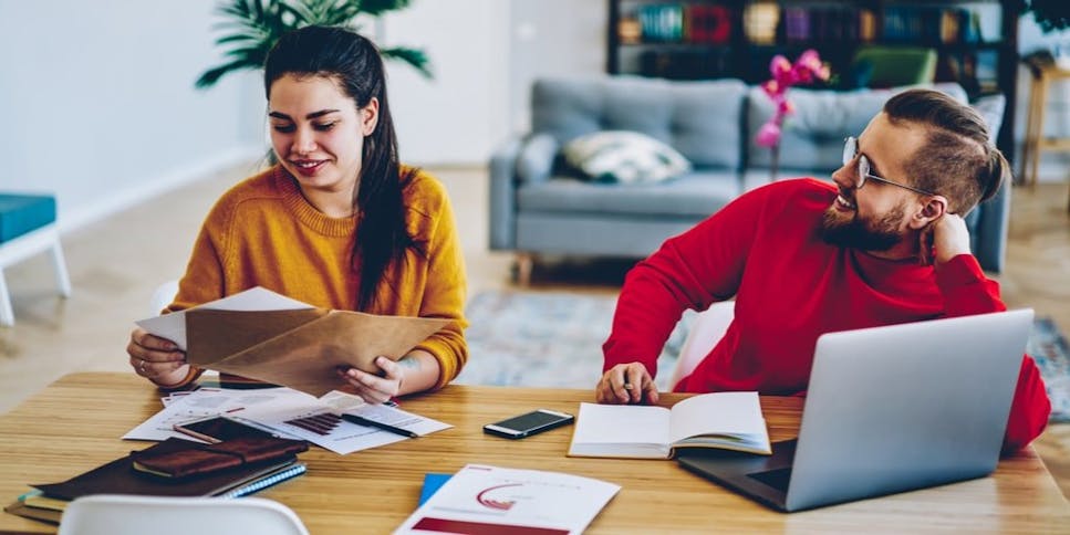Couple sorting through their bills