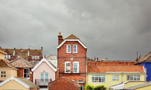 Storm clouds over colourful houses 