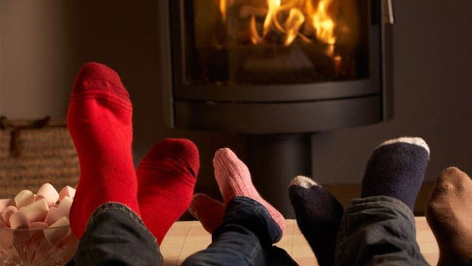 People sat in front of a fire
