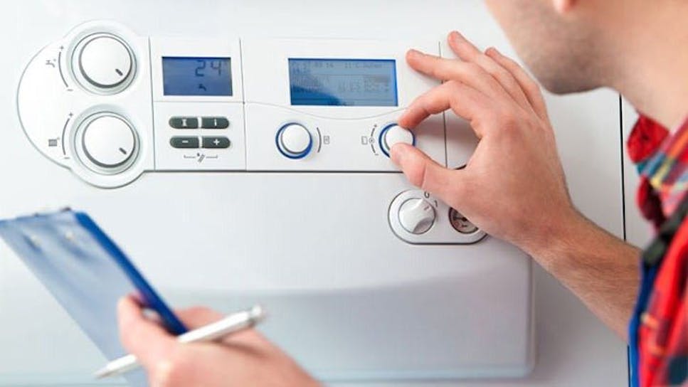 man carrying out boiler check