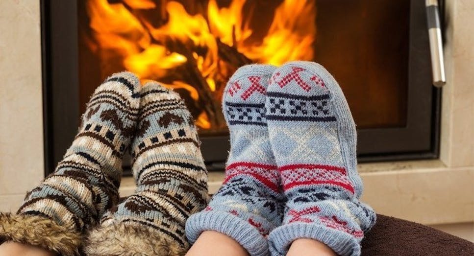 Feet being warmed by fire