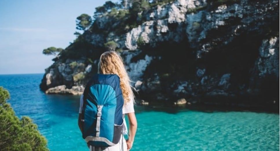 Female backpacker admiring view