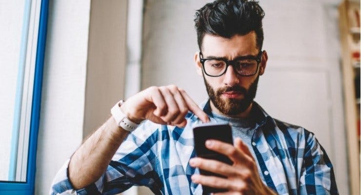 man looking at phone