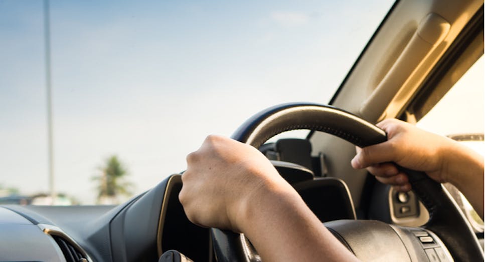man driving car