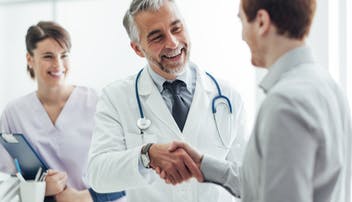 Image showing a doctor shaking a mans hand