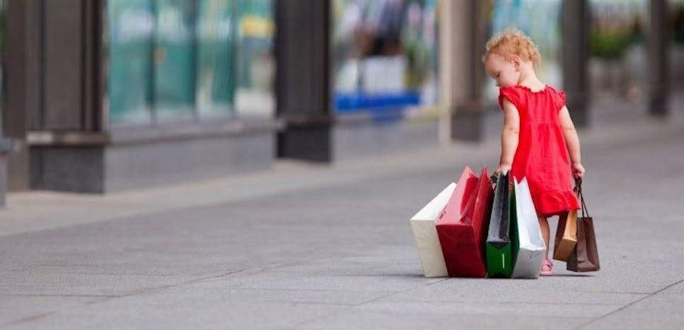 Little girl with bags