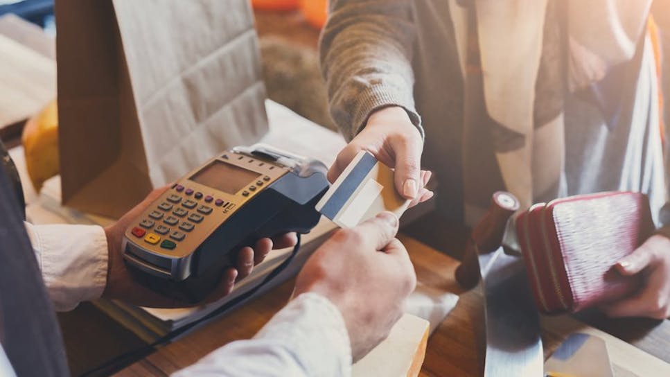 Woman paying with credit card