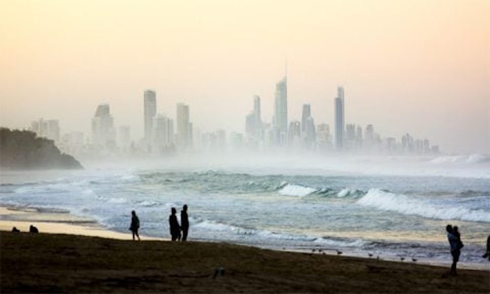 Beach at sunset with cityscape background - Gold Goast, Australia