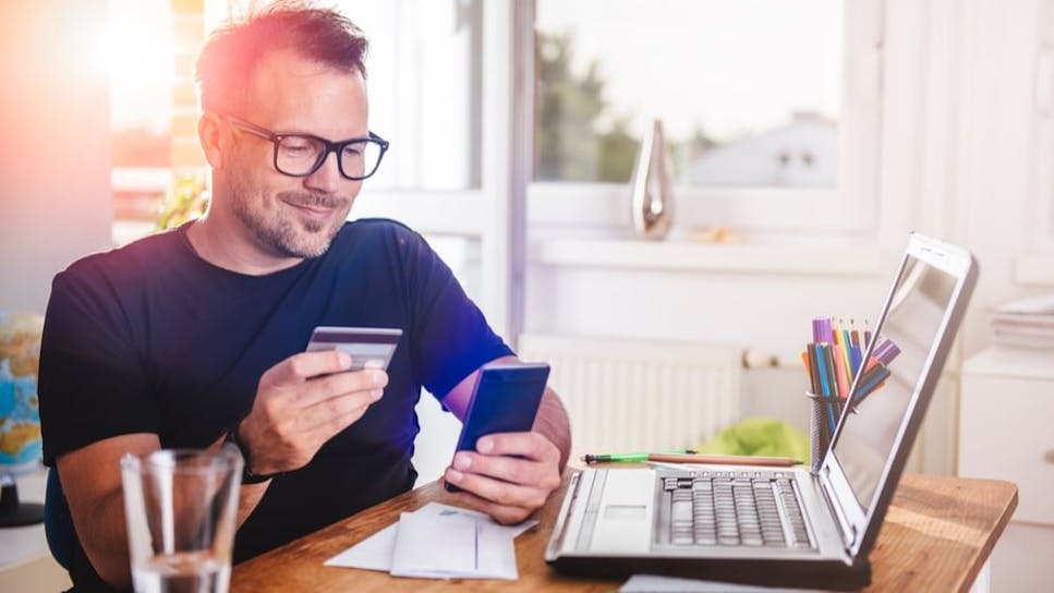 Man with credit card and laptop