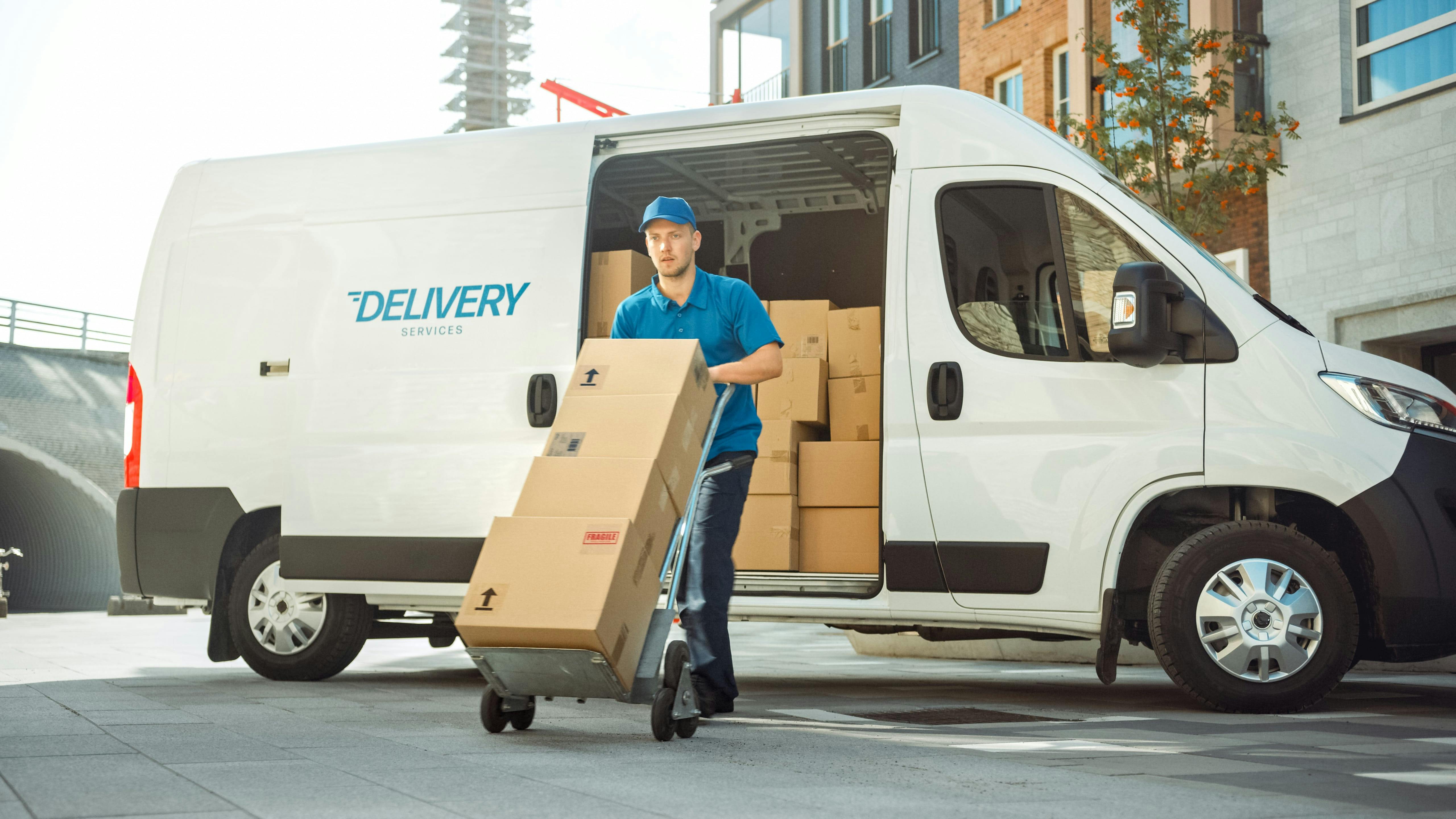 White van with "delivery" written on the side.