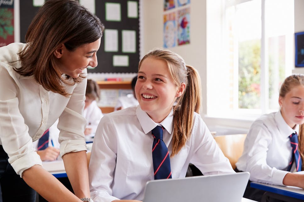 Teacher helping a female student