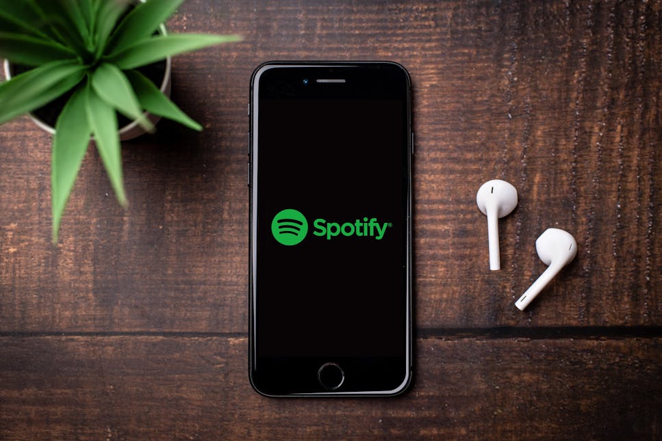 A mobile phone with the Spotify logo