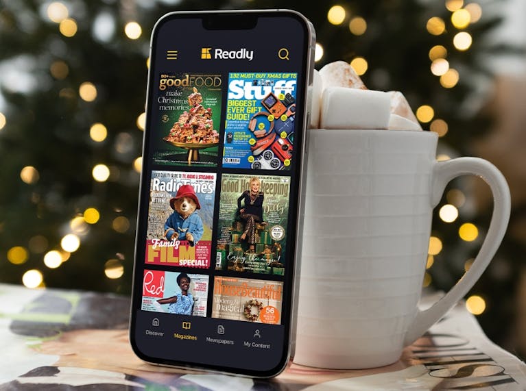 Image of mobile phone showing examples of Readly magazines