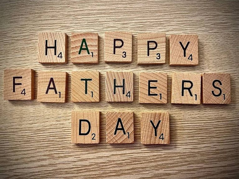 Happy Fathers Day spelled out in Scrabble tiles