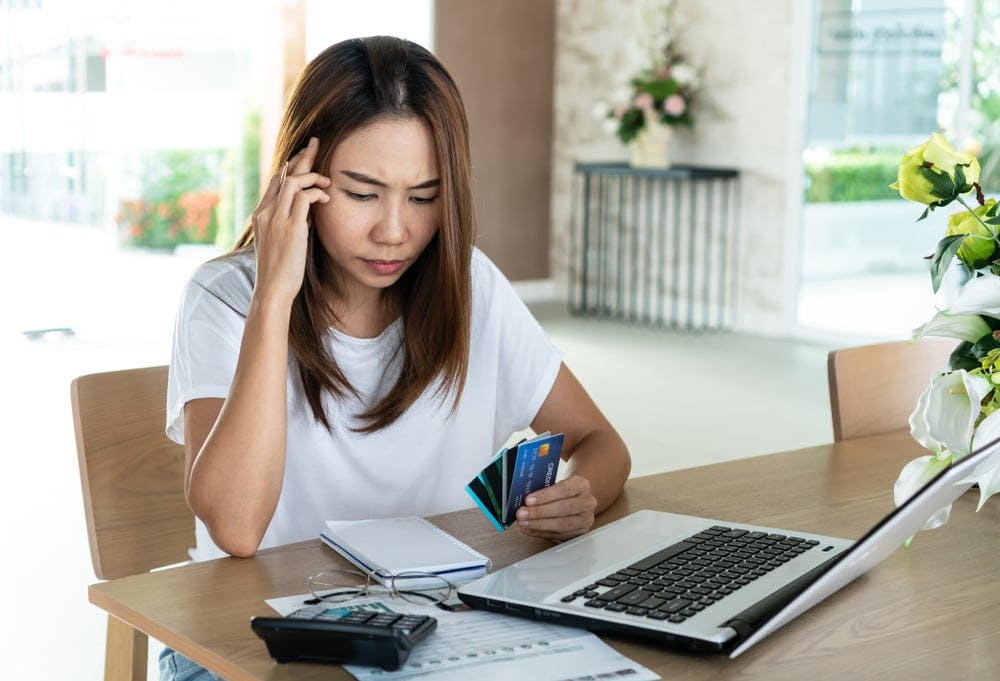 hero-igd-debt-consolidation-laptop-stressed-woman.jpg