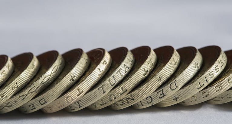 A line of old round pound coins