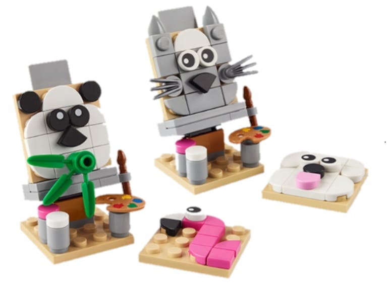 Image shows two Lego figures of painted art canvases. One of a panda and another of a cat