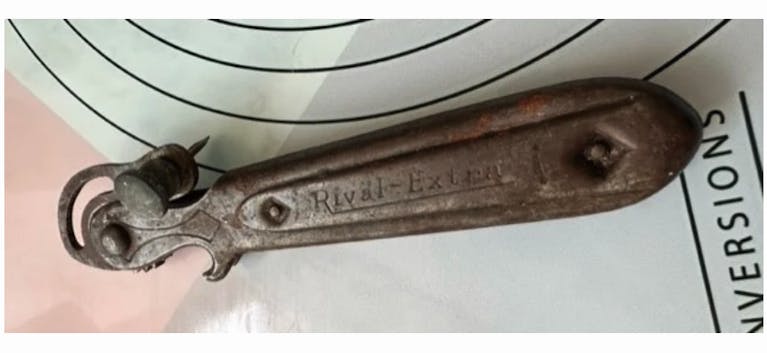 A vintage metal can opener