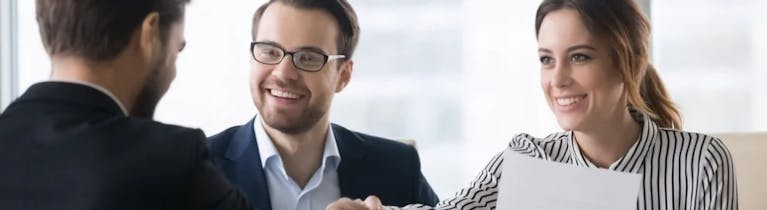 Stock image shows three people holding a job interview
