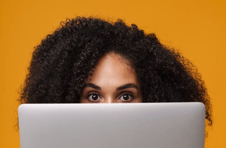 woman-looking-over-laptop.jpg