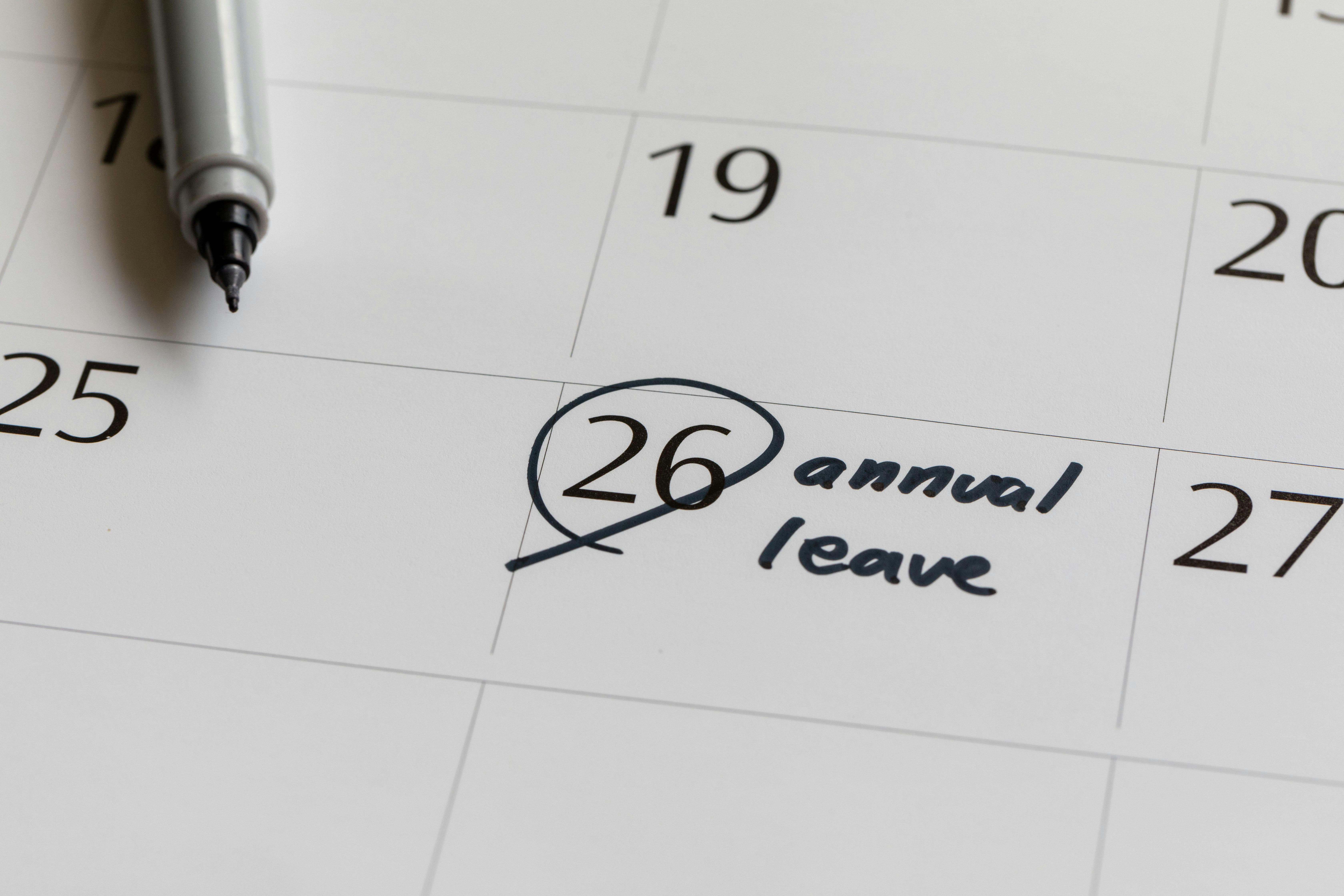 Calendar with the 26th day of the month circled, with "annual leave" written next to it.