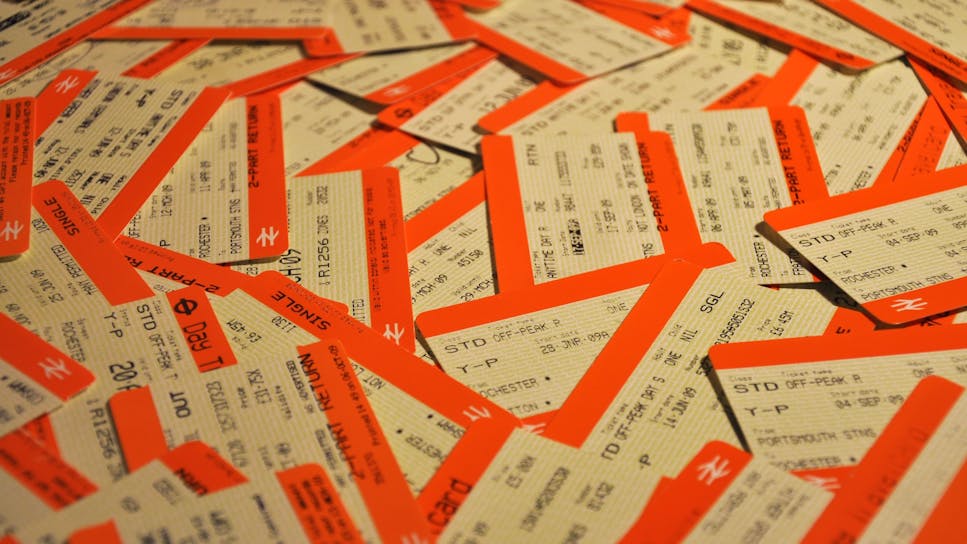 A messy stack of paper National Rail tickets