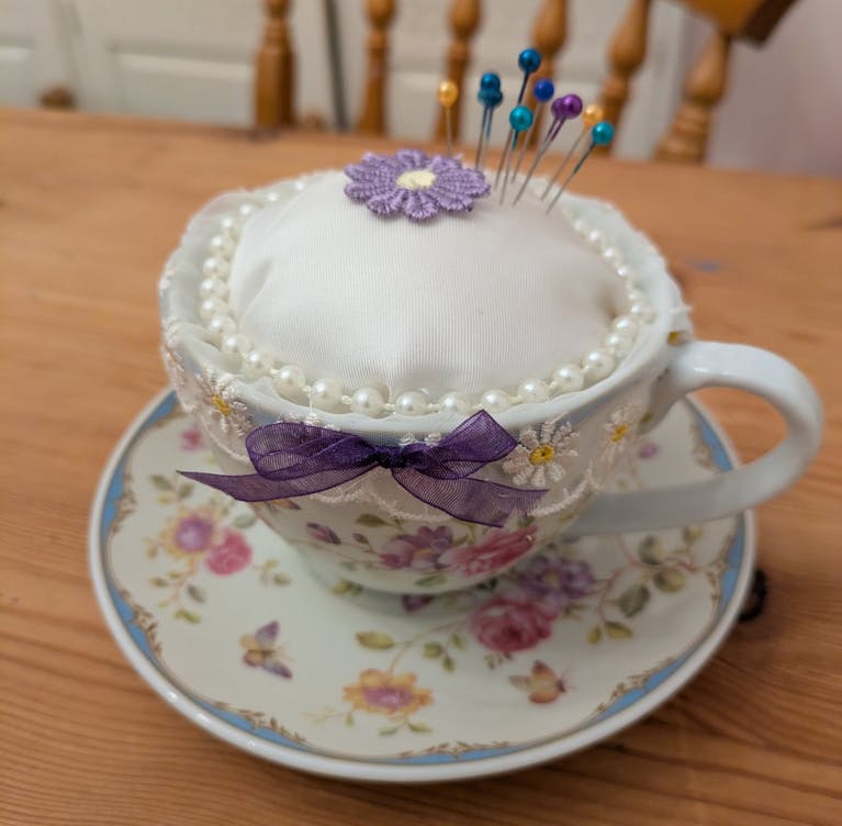Pin cushion in teacup